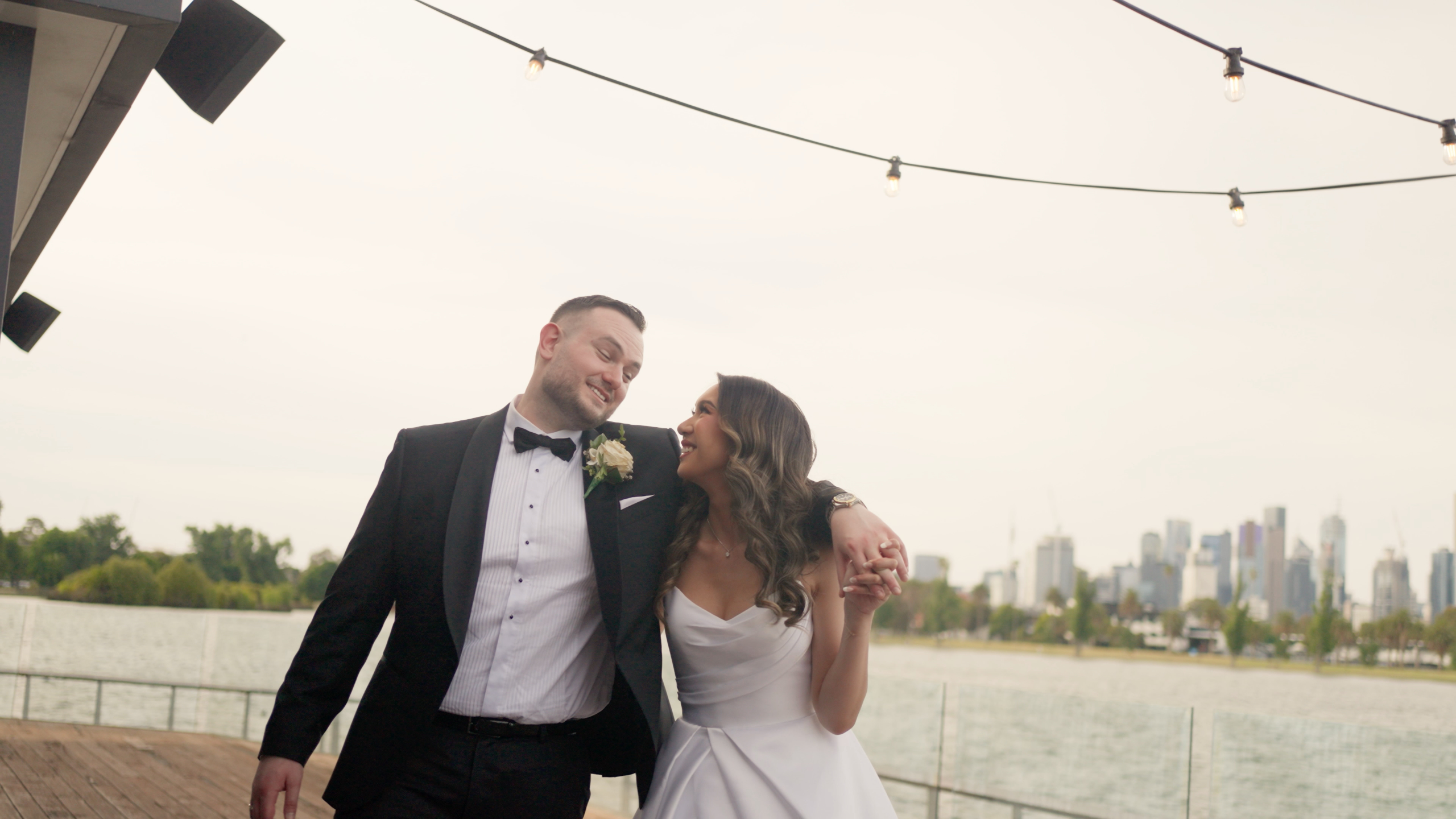 Candid, emotional wedding moment filmed at Albert Park Carousel