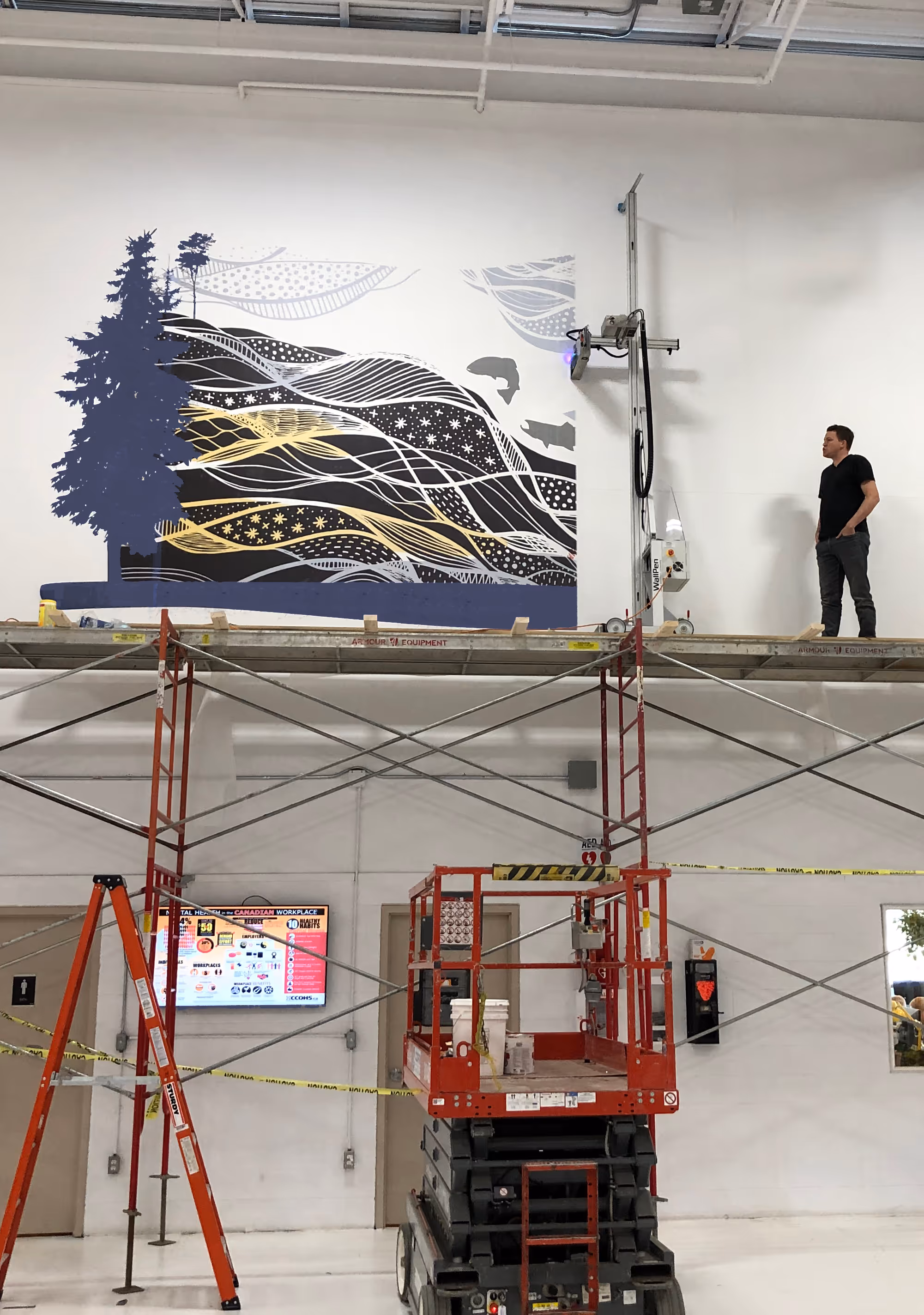 Mark on scaffolding with a wall printer printing a large mural