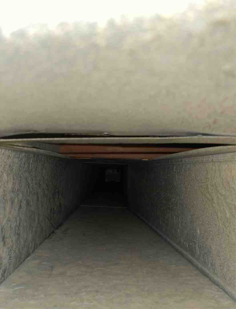 Dirty air duct interior showing dust, pet dander, and debris - duct cleaning waukesha wi