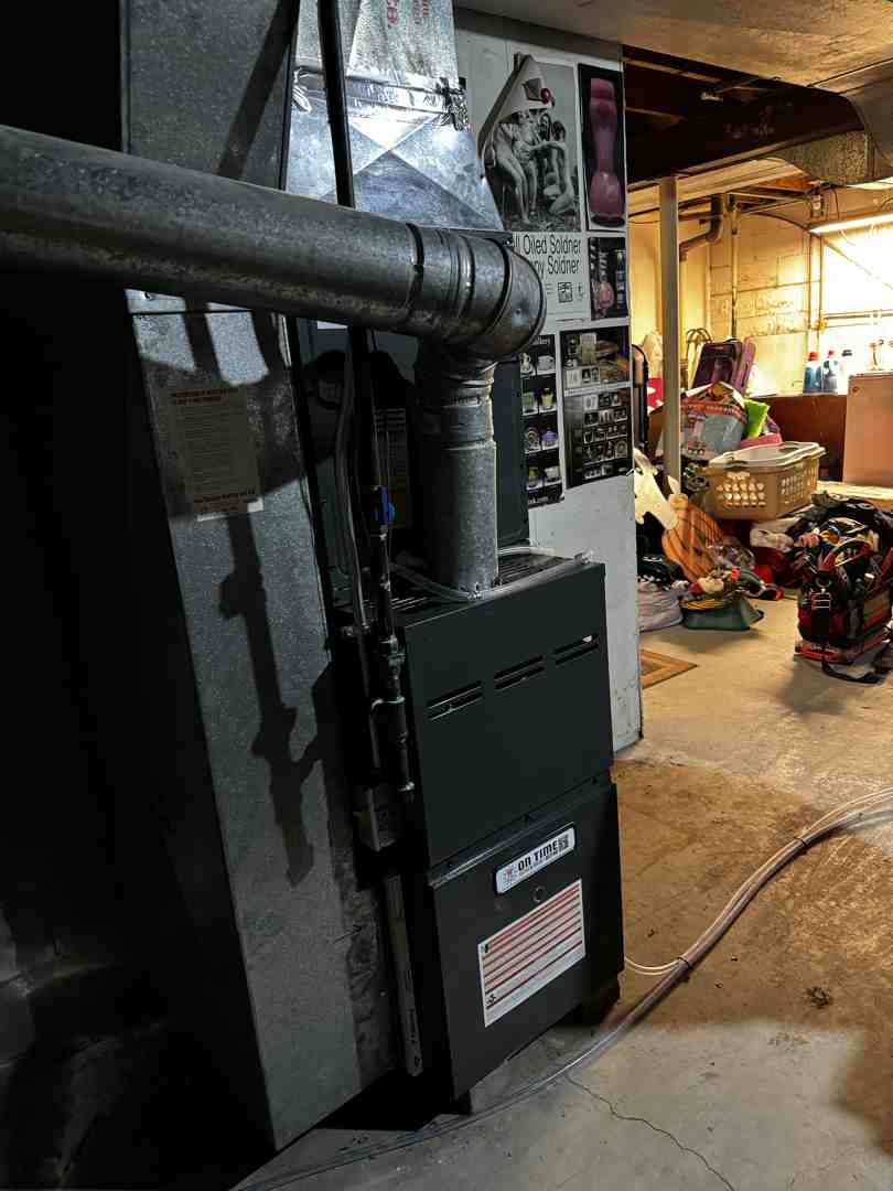 an old, inefficient furnace in a basement - gas heating installation pewaukee an old, inefficient furnace in a basement - gas heating installation pewaukee