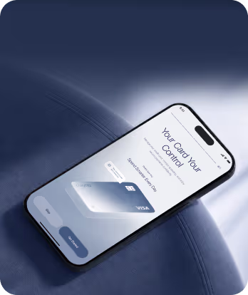 Smartphone screen showing a digital Visa card with control options on a dark blue leather surface.