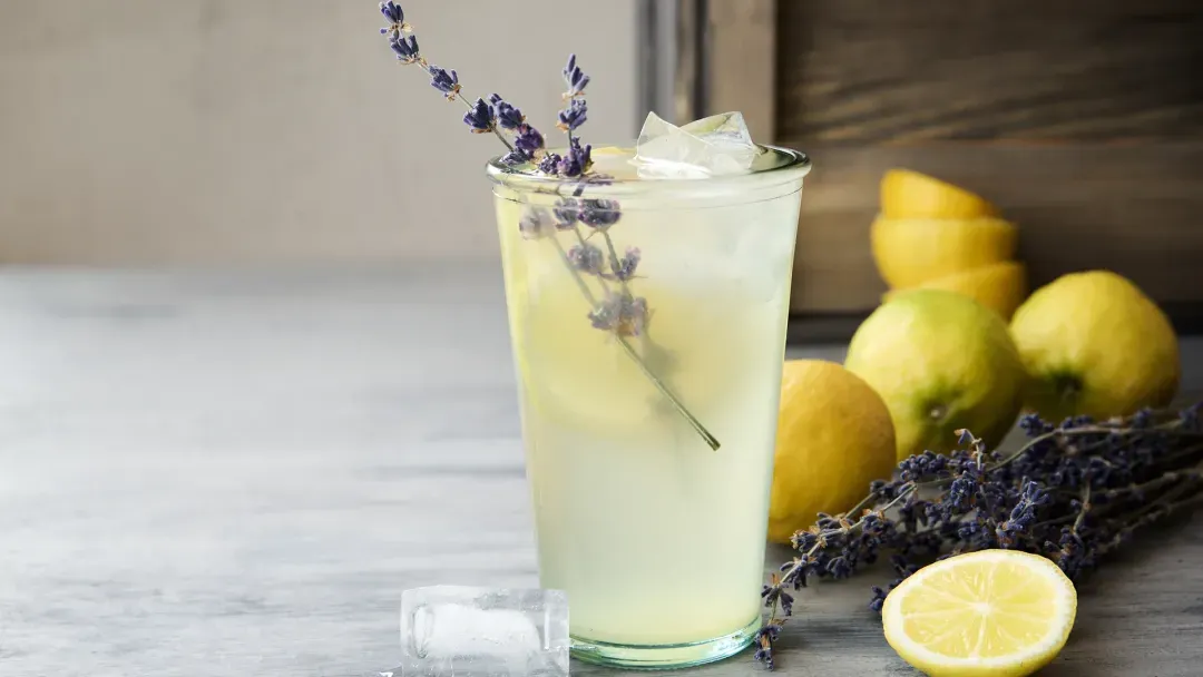 glass of lemonade with sprig of lavender