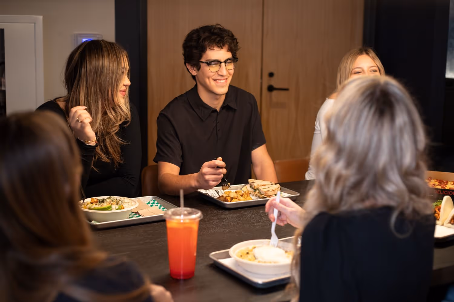People sitting around a table dining