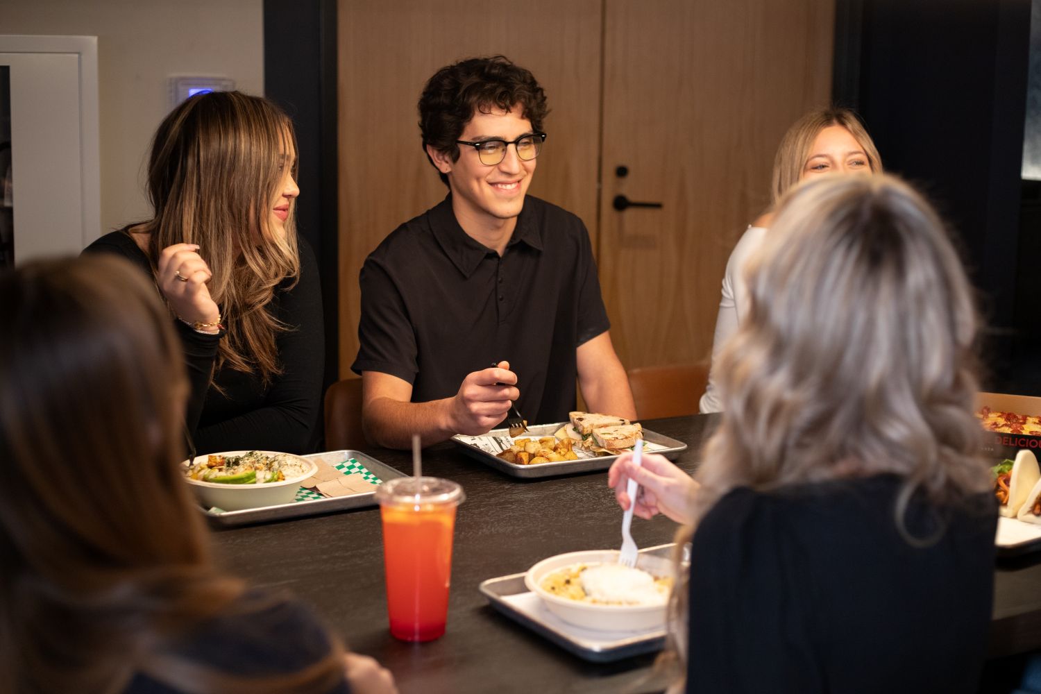 People sitting around a table dining