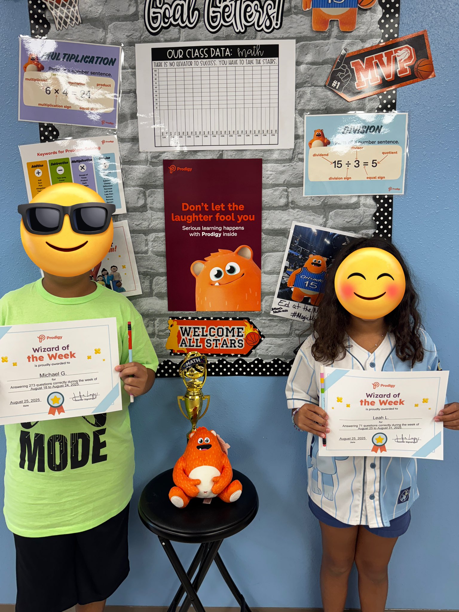 Two students celebrating Prodigy's Wizard Week