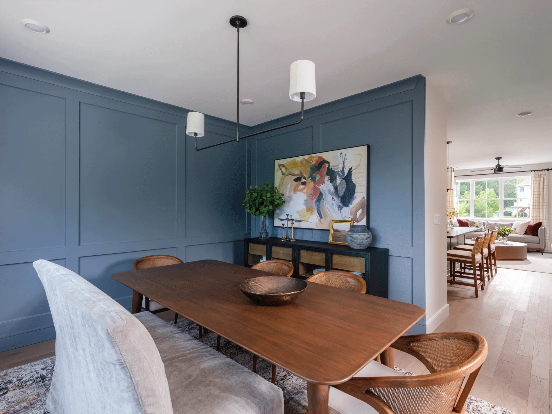 (title) Dining Room & Wall Paneling (description) Elegant dining room featuring beautiful wall paneling detail at Larkwood — custom millwork and designer finishes in new construction townhomes in Raynham, MA.