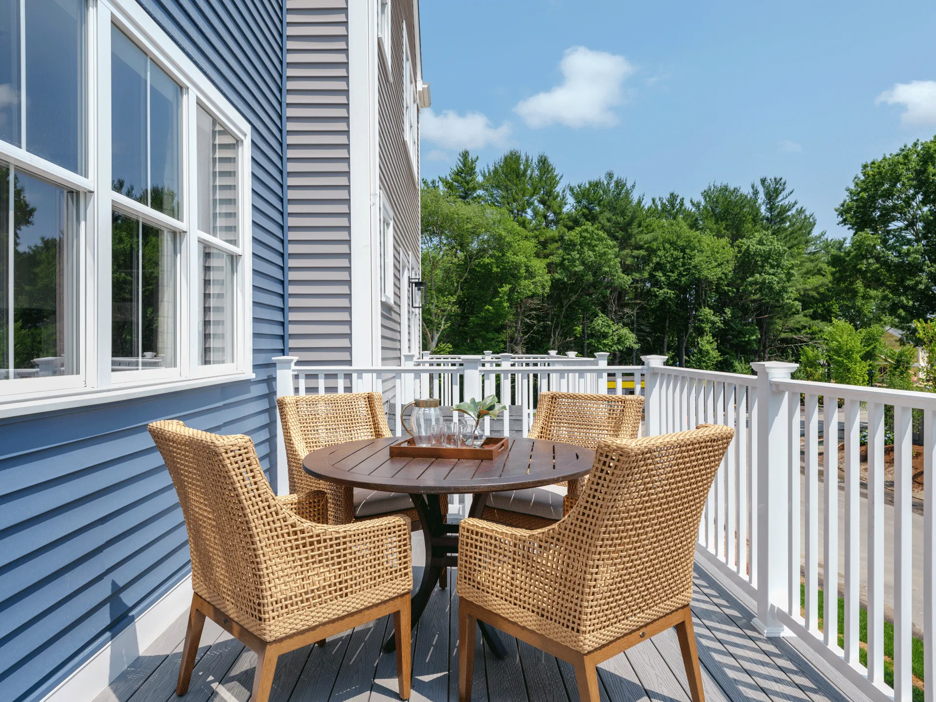 (title) Private Deck (description) A private deck overlooking the landscaped courtyard at Larkwood — outdoor living is part of every new townhome for sale in Raynham, Massachusetts.