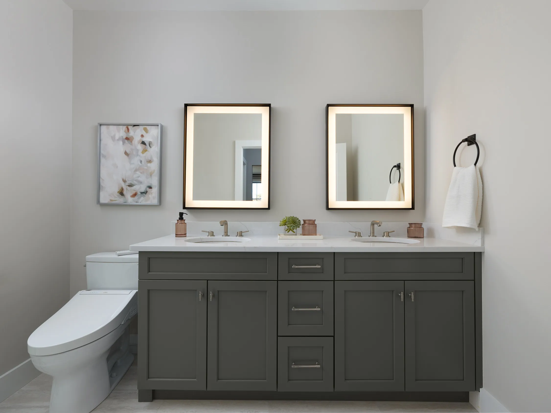 Primary bath with charcoal cabinetry in the Pine at Alden's Reach in Plymouth MA