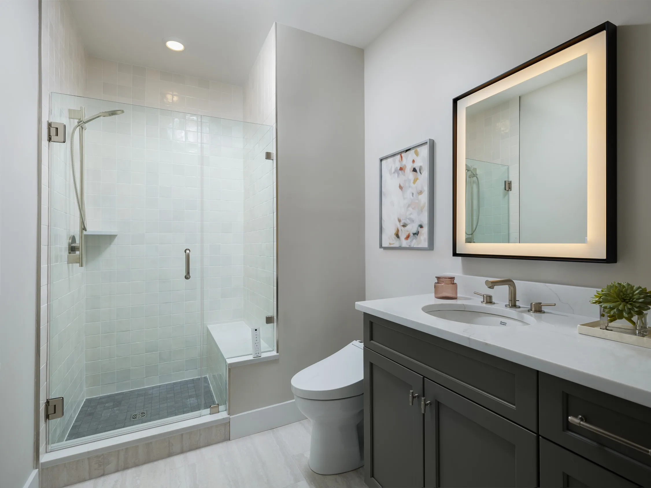 Primary bath with tiled walk-in shower and bench in the Pine at Alden's Reach in Plymouth MA