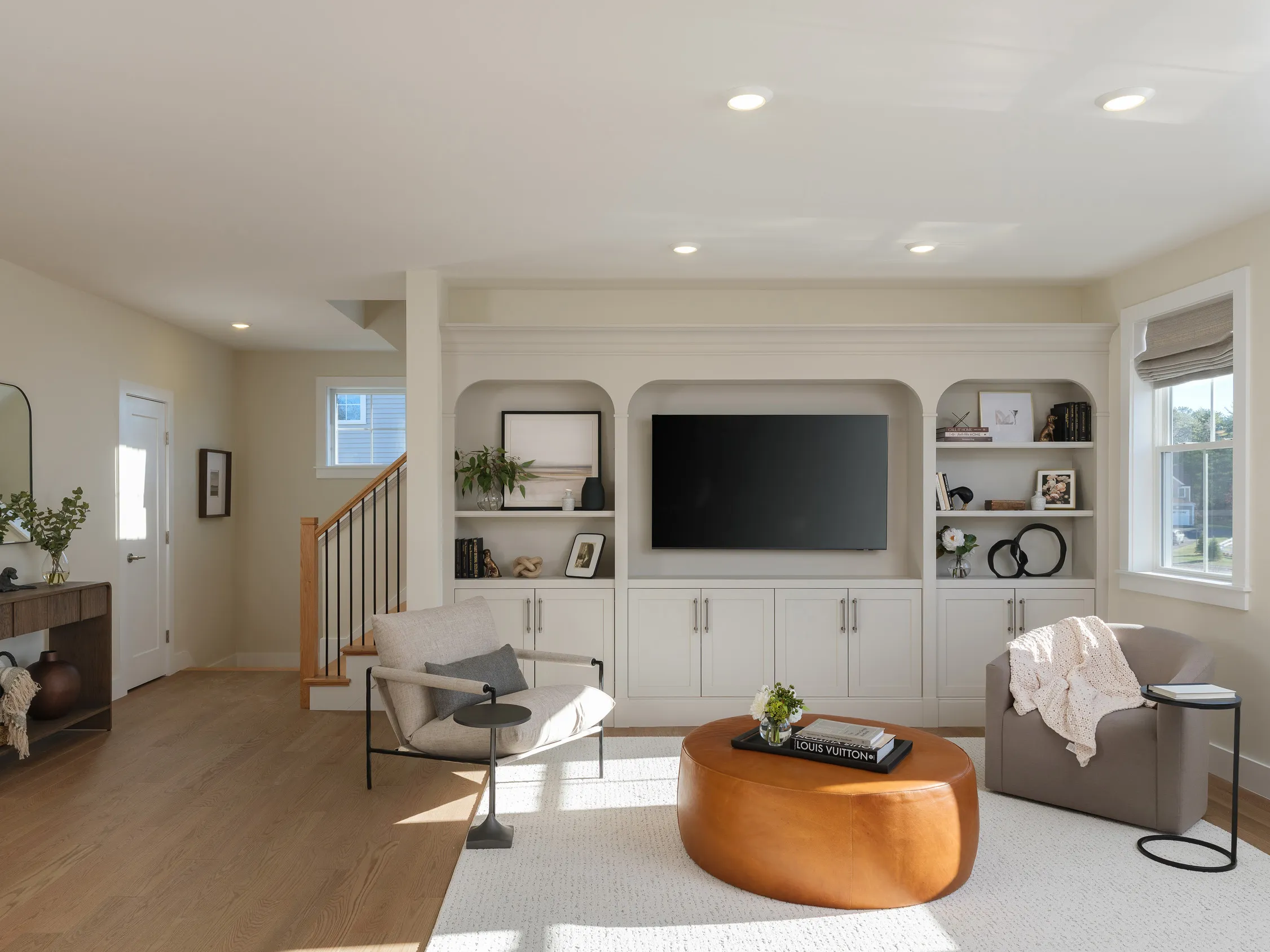 Living room with custom built-ins in the Pine at Alden's Reach in Plymouth MA