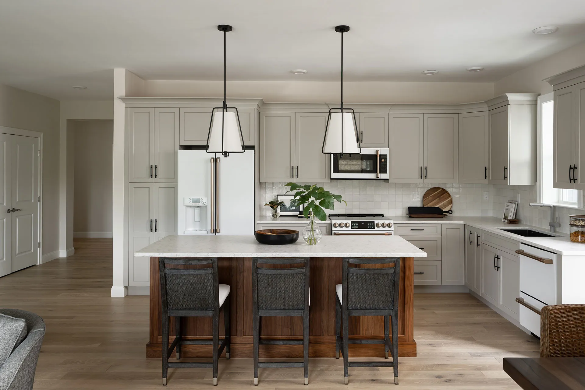 Chef-ready kitchen with quartz countertops and custom cabinetry at Featherwinds 55+ condos in Halifax MA