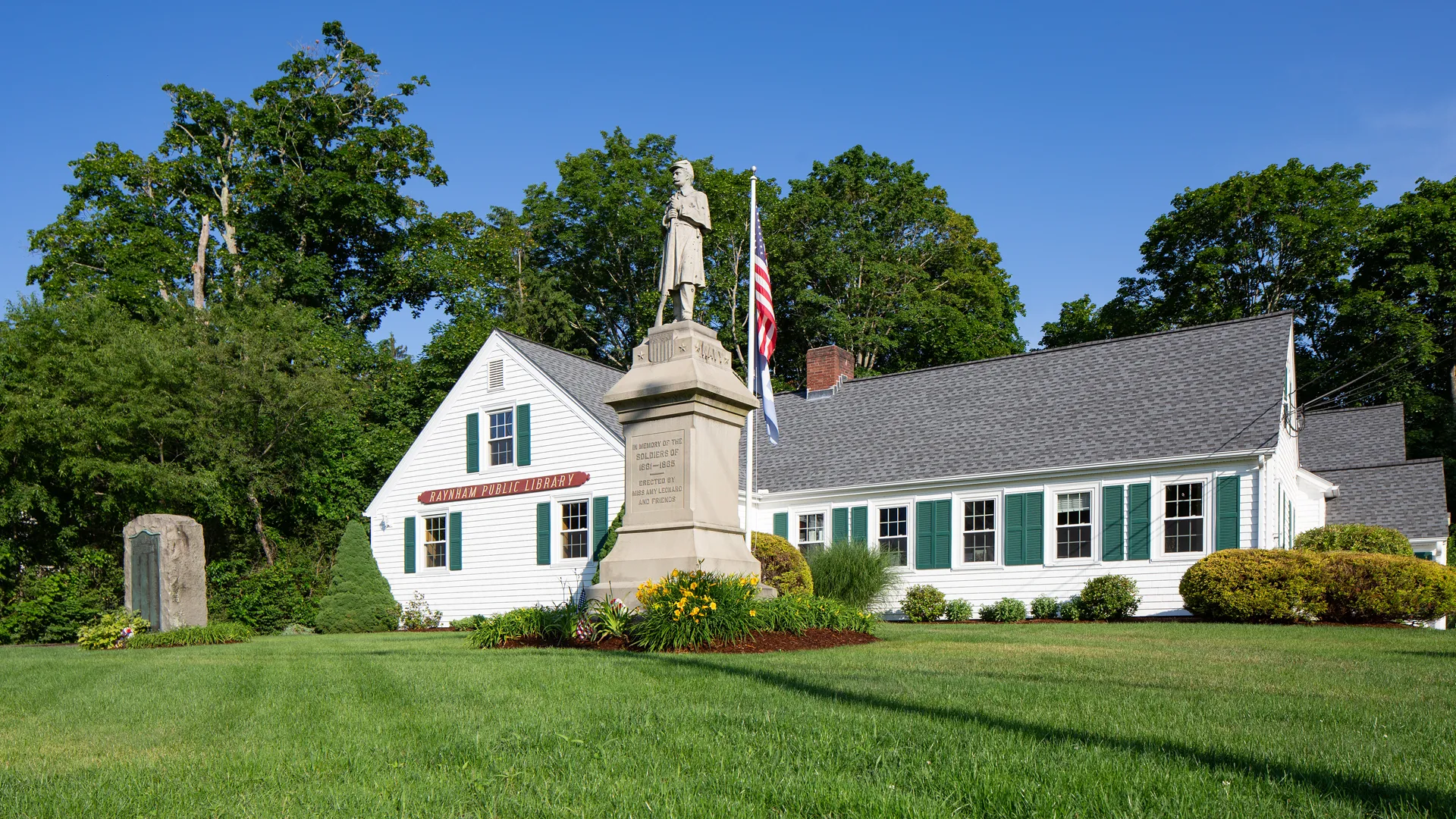 Raynham Public Library with Civil War memorial in Raynham MA