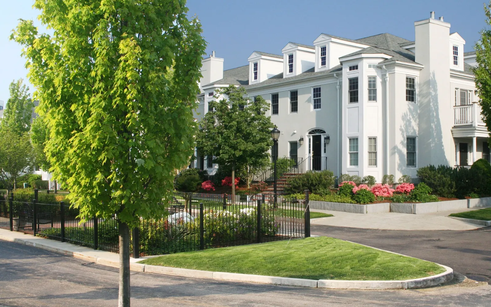 Condominiums with manicured landscaping at Chapman's Reach, Smart Growth community in Quincy MA