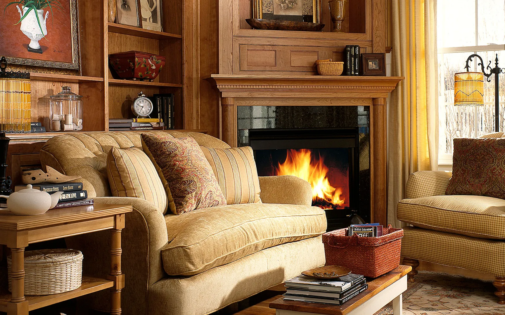Cozy living room with fireplace and built-ins at Red Mill Village in Norton MA