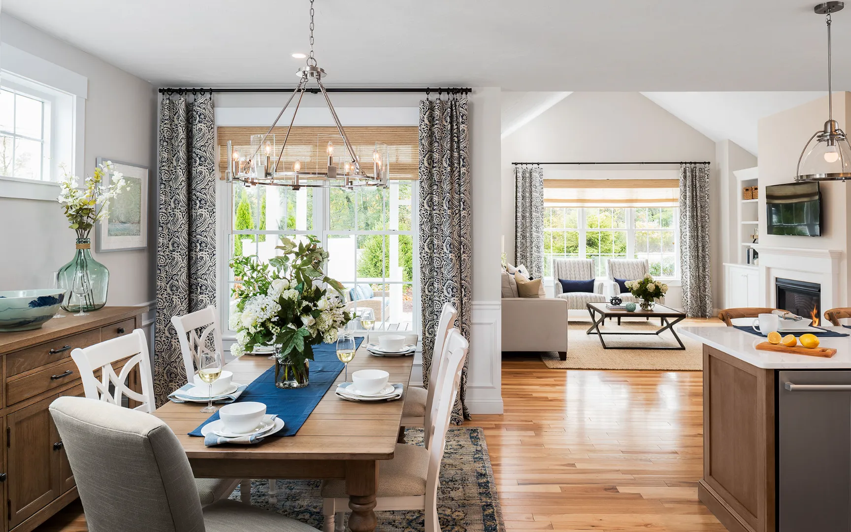 Bright dining area with hardwood floors and bay window in Summer Reach model home Plymouth Massachusetts