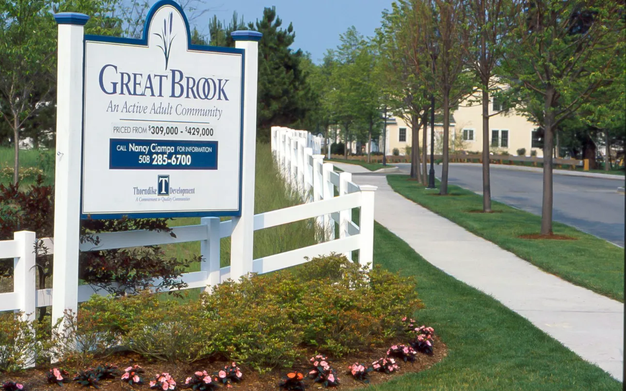 Welcome sign at the entrance to GreatBrook active adult neighborhood in Norton MA