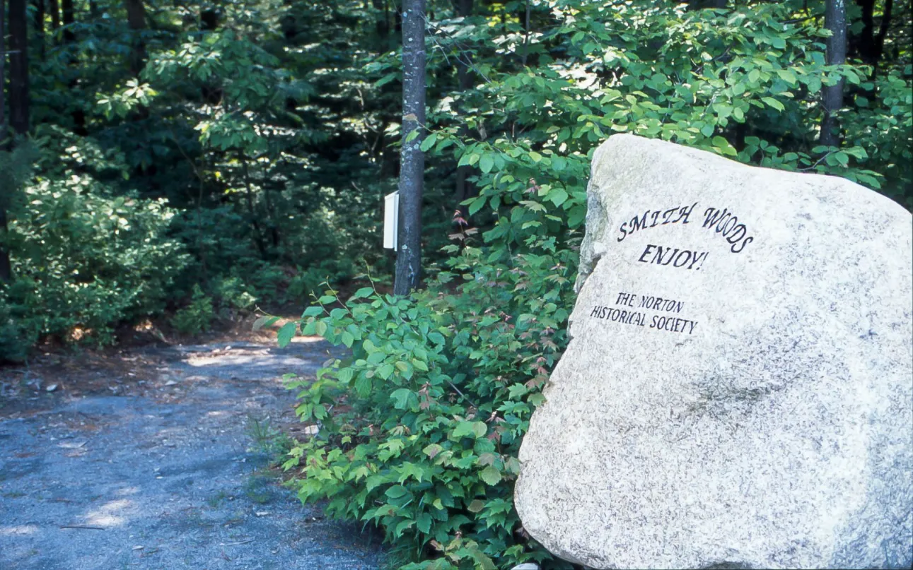Smith Woods nature trail boulder marker near GreatBrook walking paths in Norton MA