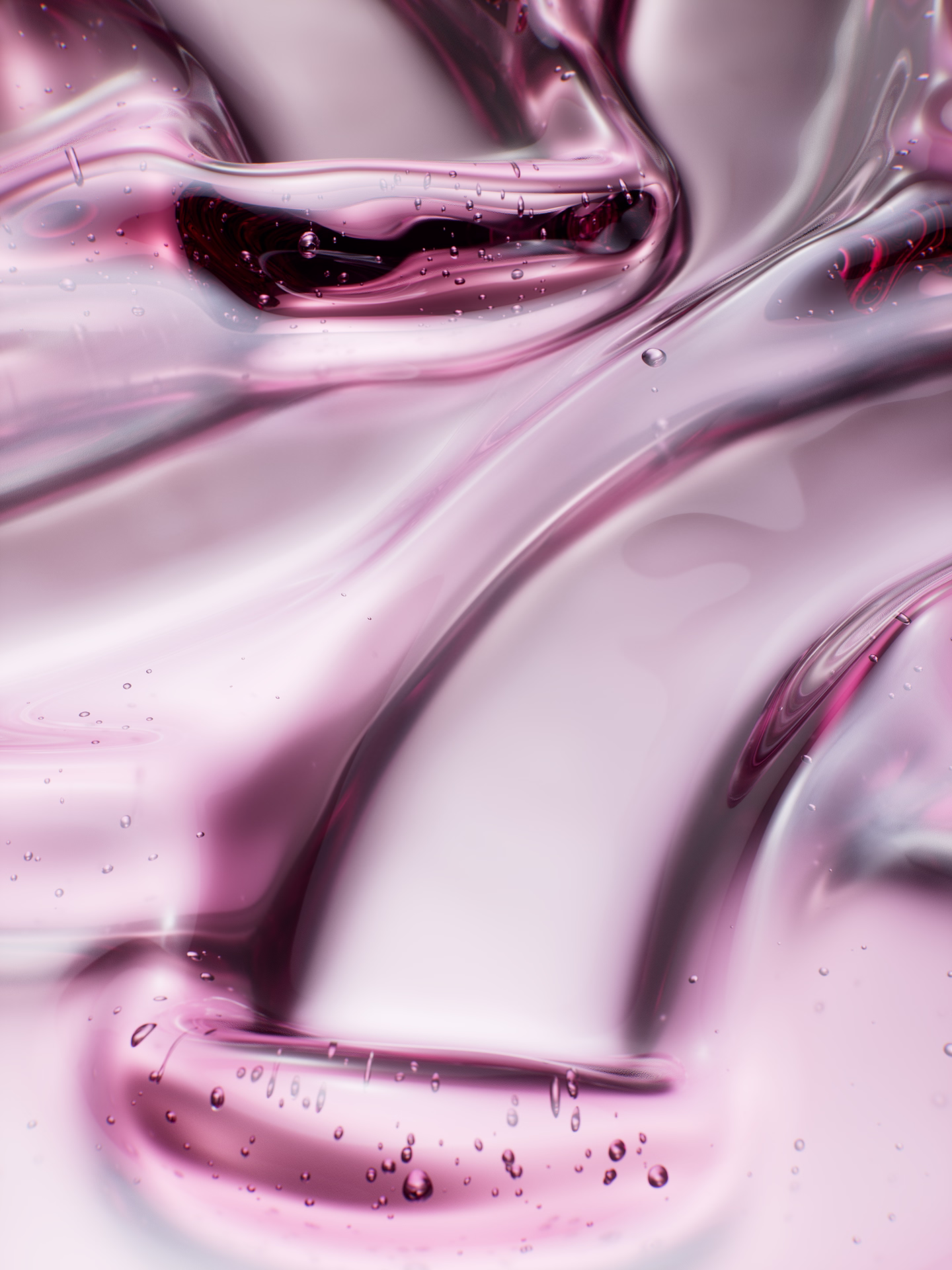 Close-up of translucent pink gel or liquid with bubbles and smooth flowing texture.
