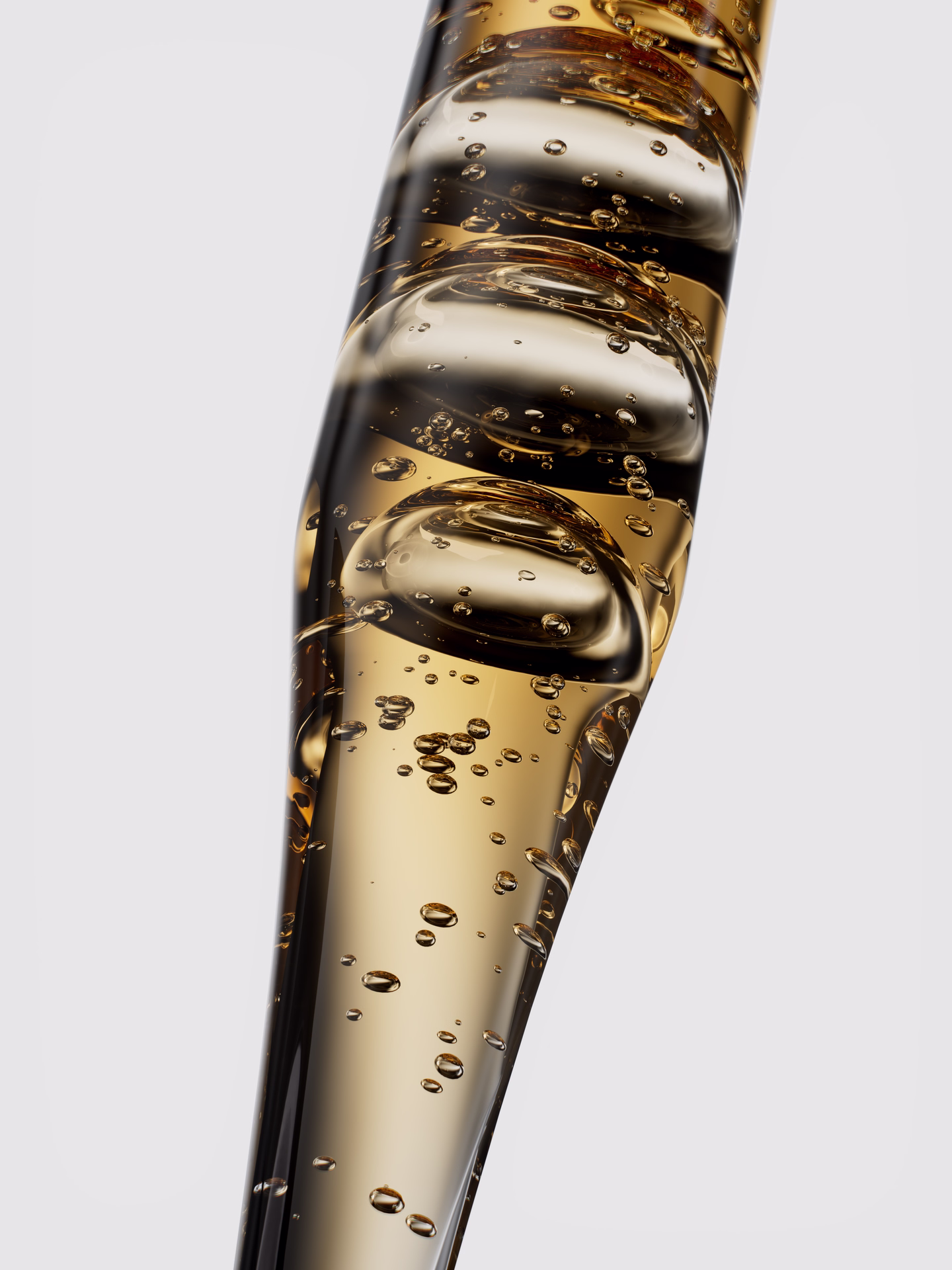 Close-up of a dropper filled with clear liquid and visible air bubbles inside.