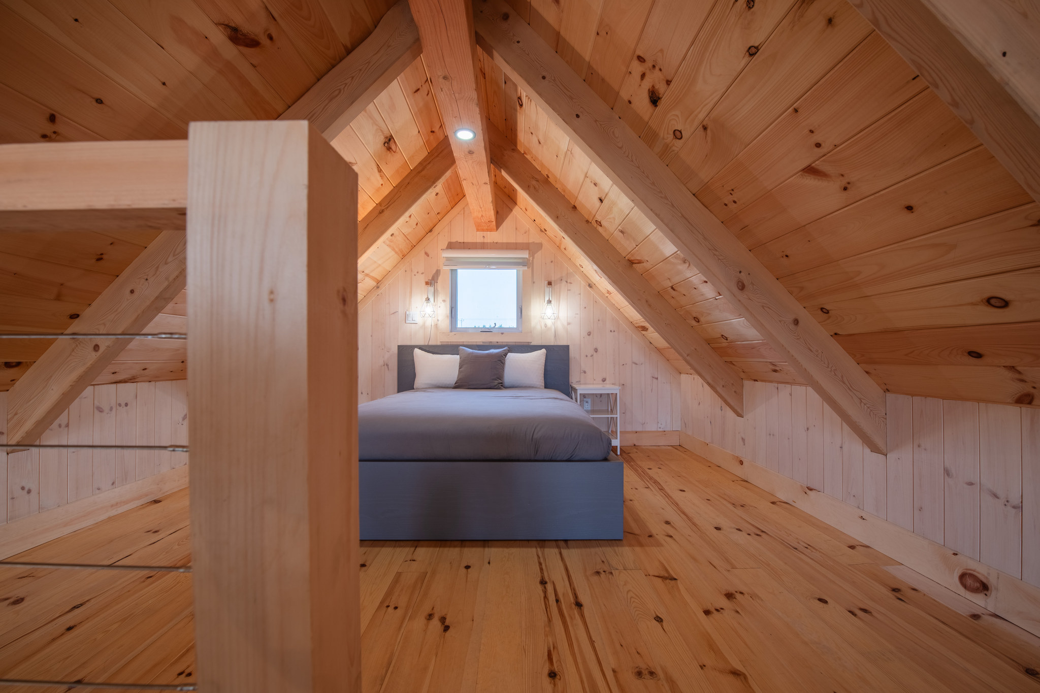 Bedroom upstairs under the gable of the Swiss-style chalet