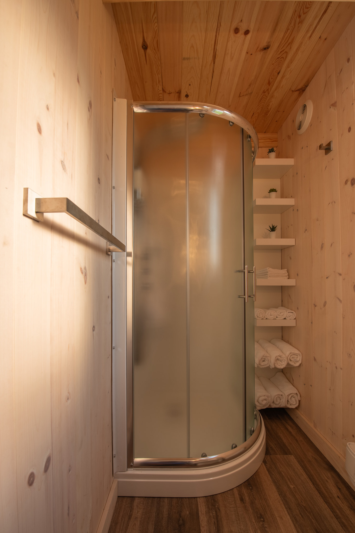 Rounded shower in the Swiss-style cabin's bathroom
