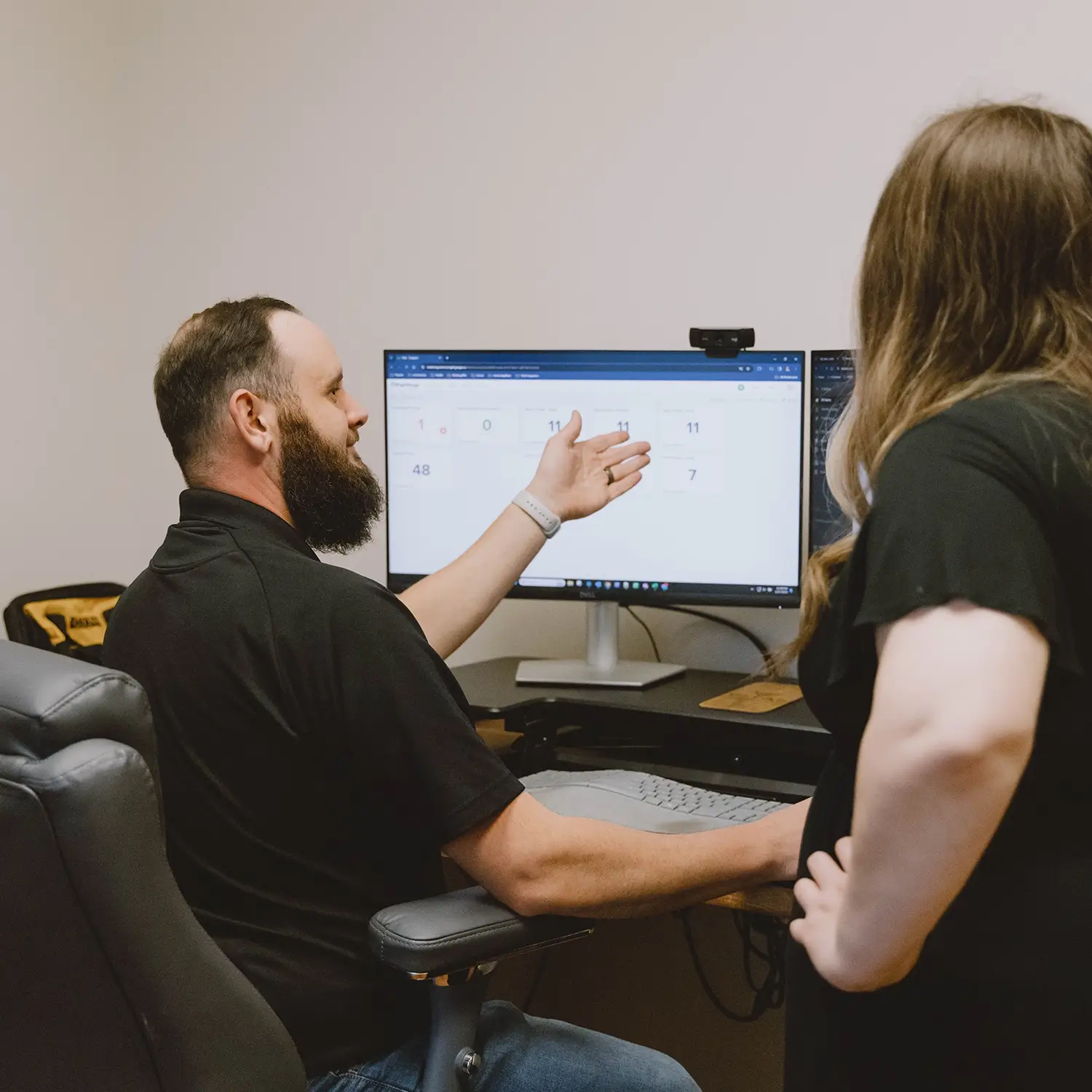 Vital Integrators technicians reviewing a screen together