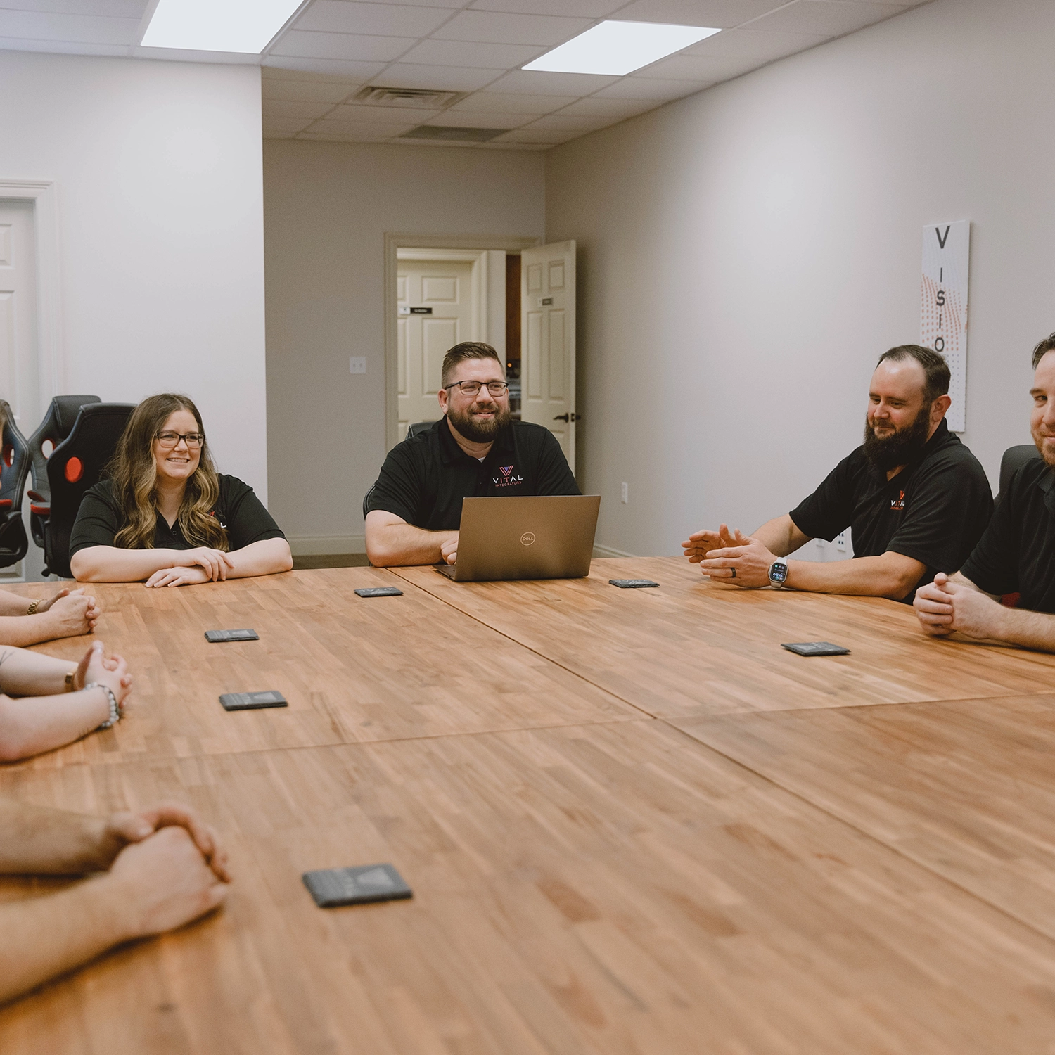 Vital Integrators team meeting in the conference room
