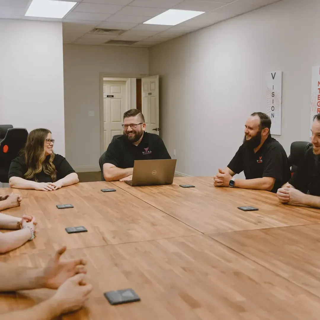Vital Integrators team meeting around a conference table