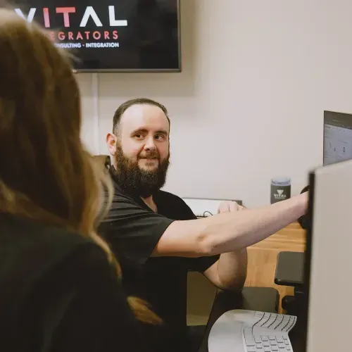 Vital Integrators technician working at a computer