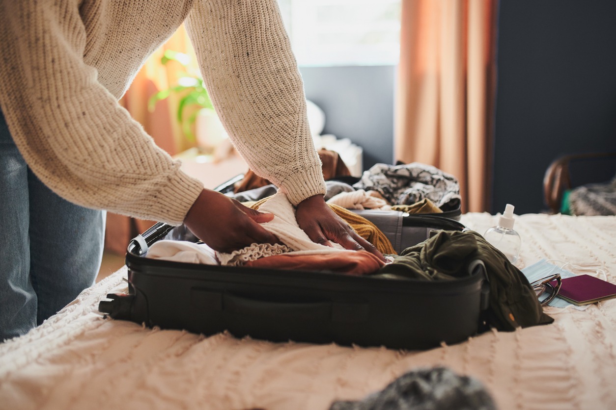 woman packing suitcase for new orleans