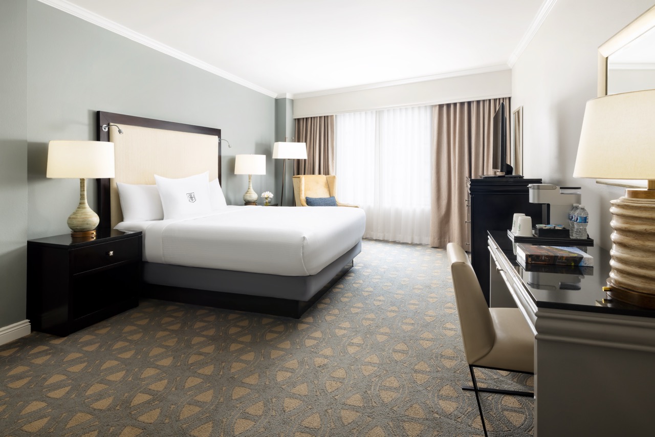 Deluxe King bedroom with desk and tv