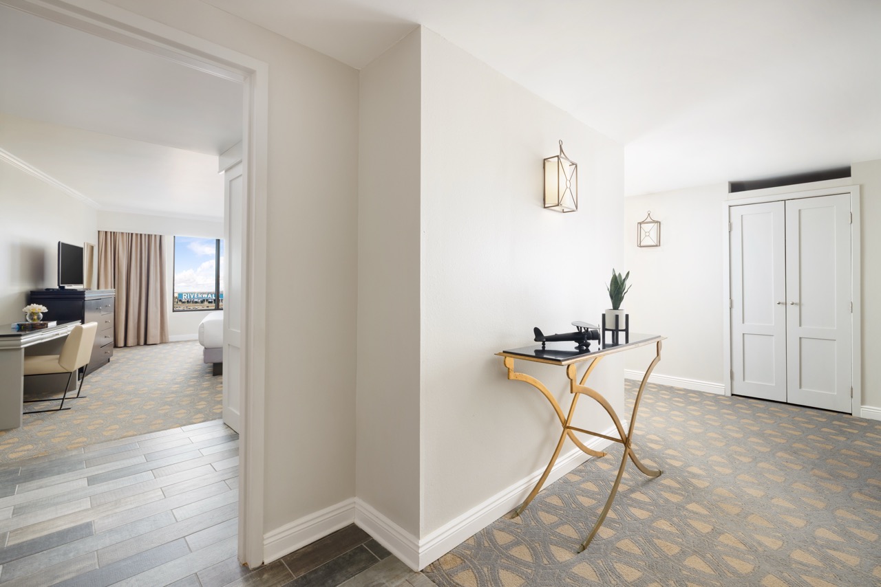 Luxury King Suite entry way with view of living room and hallway