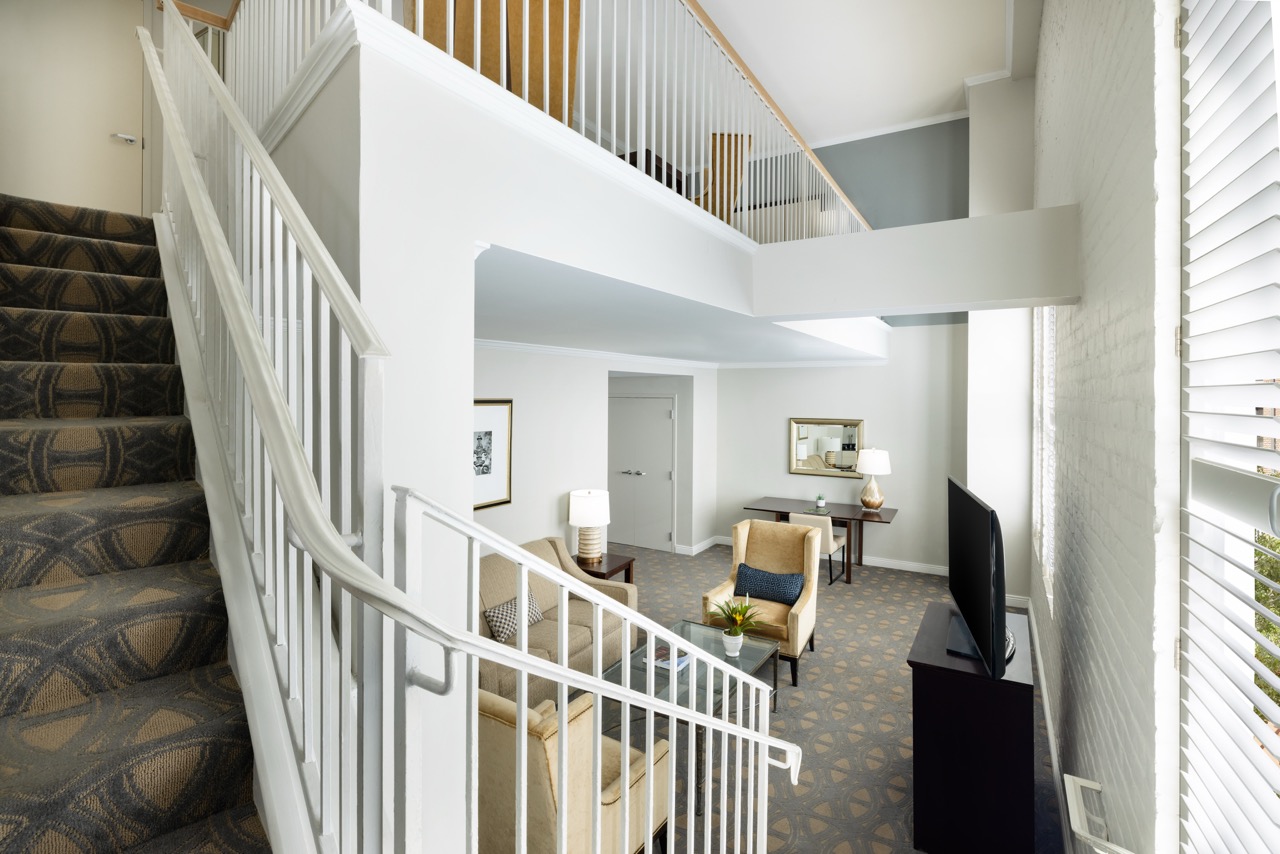Hospitality Loft Suite with two levels, brick wall and a view