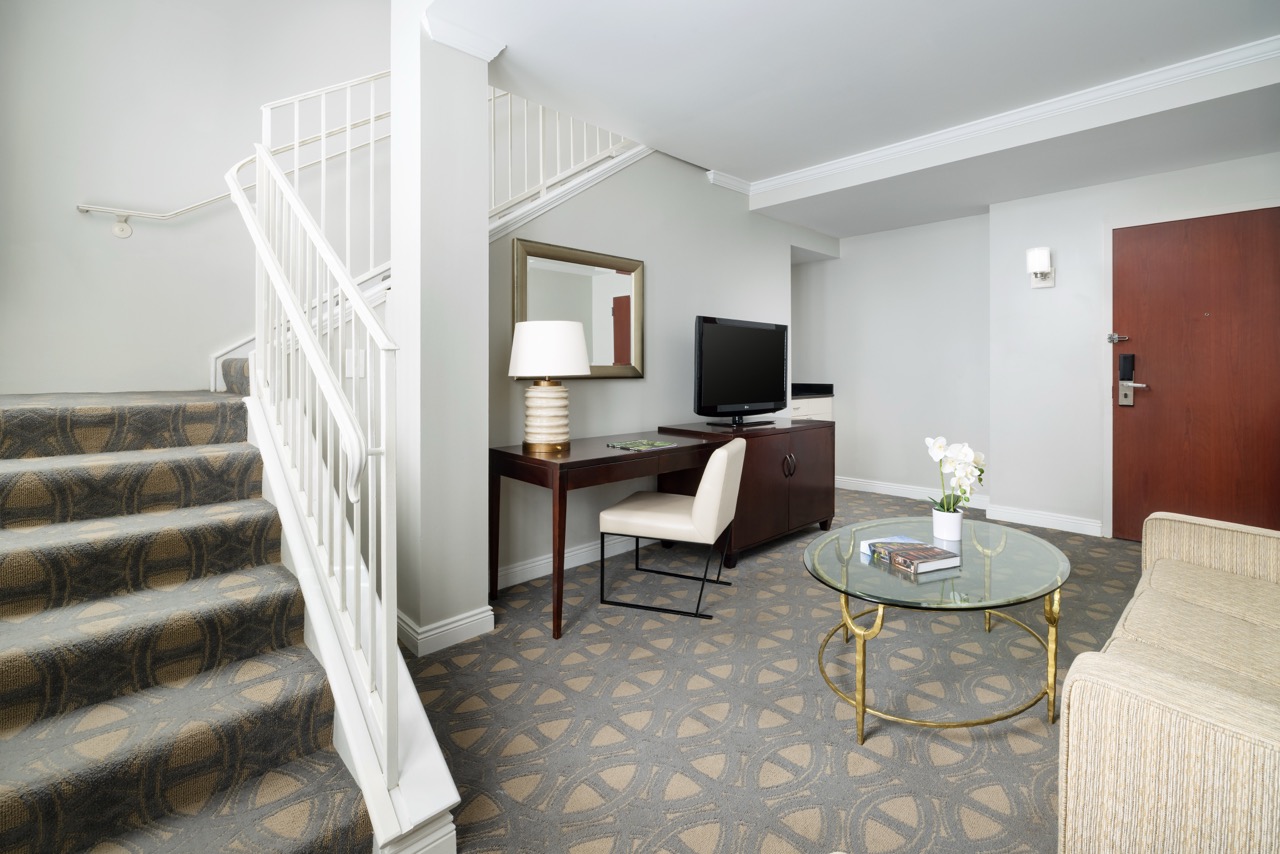 Executive Hospitality Loft Suite with stairs and entryway