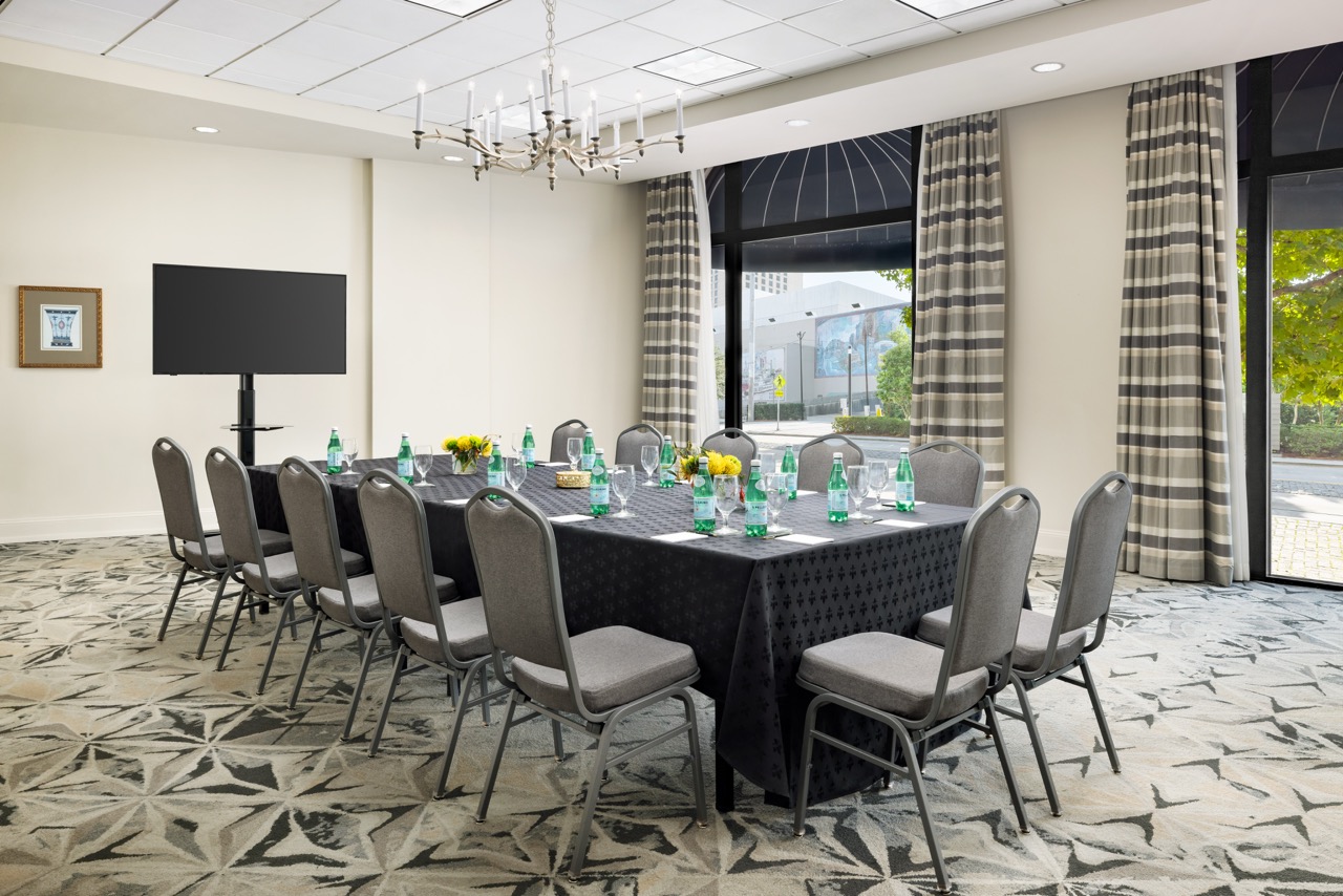Riverfront Boardroom with tv and chandalier