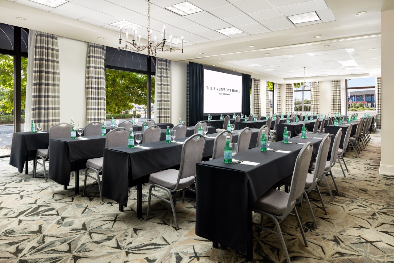 Riverfront Classroom seating with projector screen at front of the room