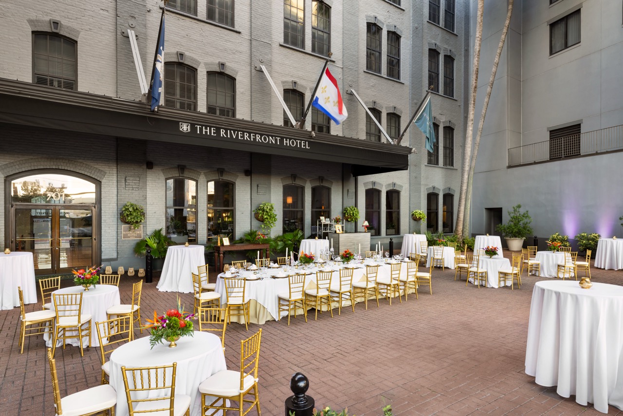 Riverfront Courtyard Social with seating and main table