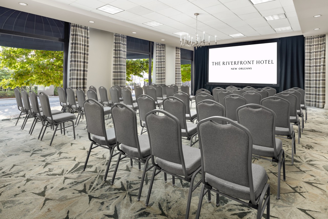Riverfront Theatre with projector screen and row seating