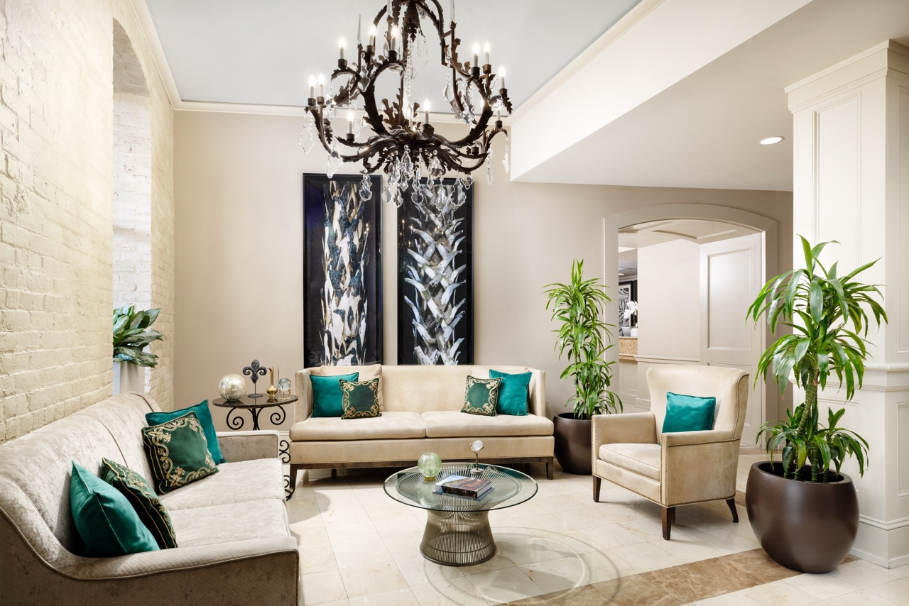 elegant Lobby Seating with artwork on walls and lighting