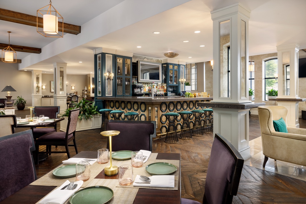 Riverfront Bar Seating with dining tables and elegant lighting