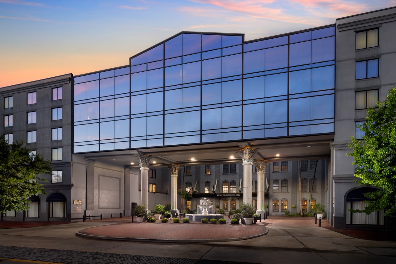 Riverfront Exterior at Dawn with light reflecting from glass