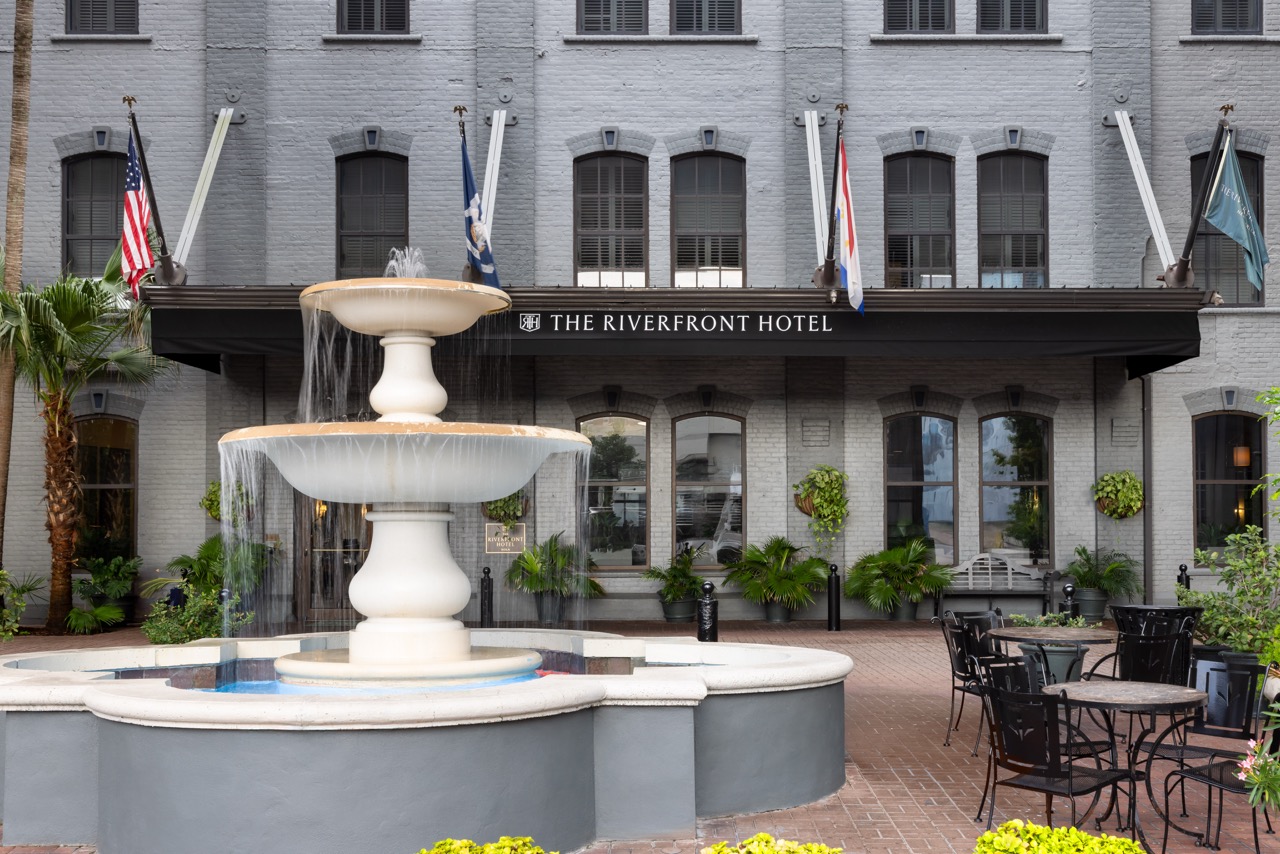 Riverfront Courtyard with fountain, flags and outdoor seating
