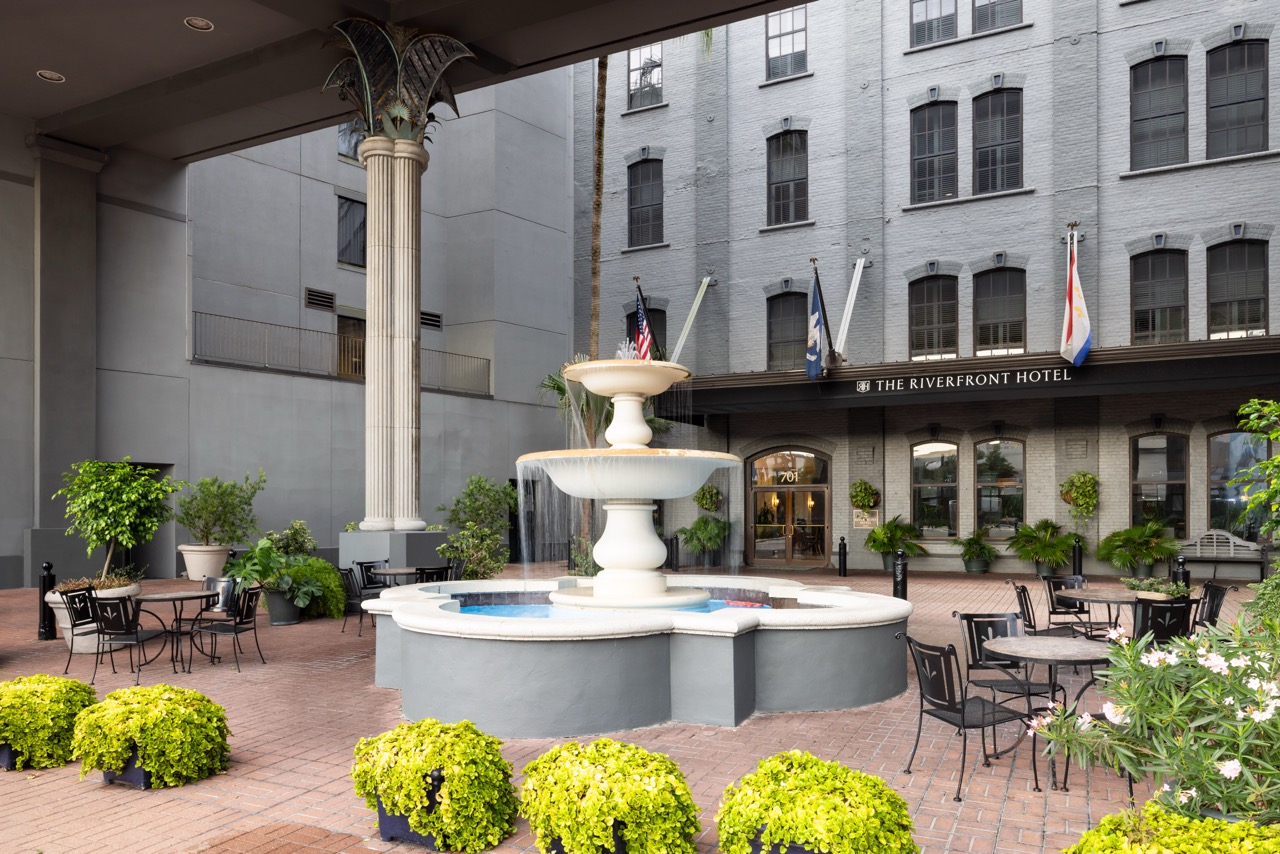 Riverfront Courtyard Fountain in front of main entrance with greenery