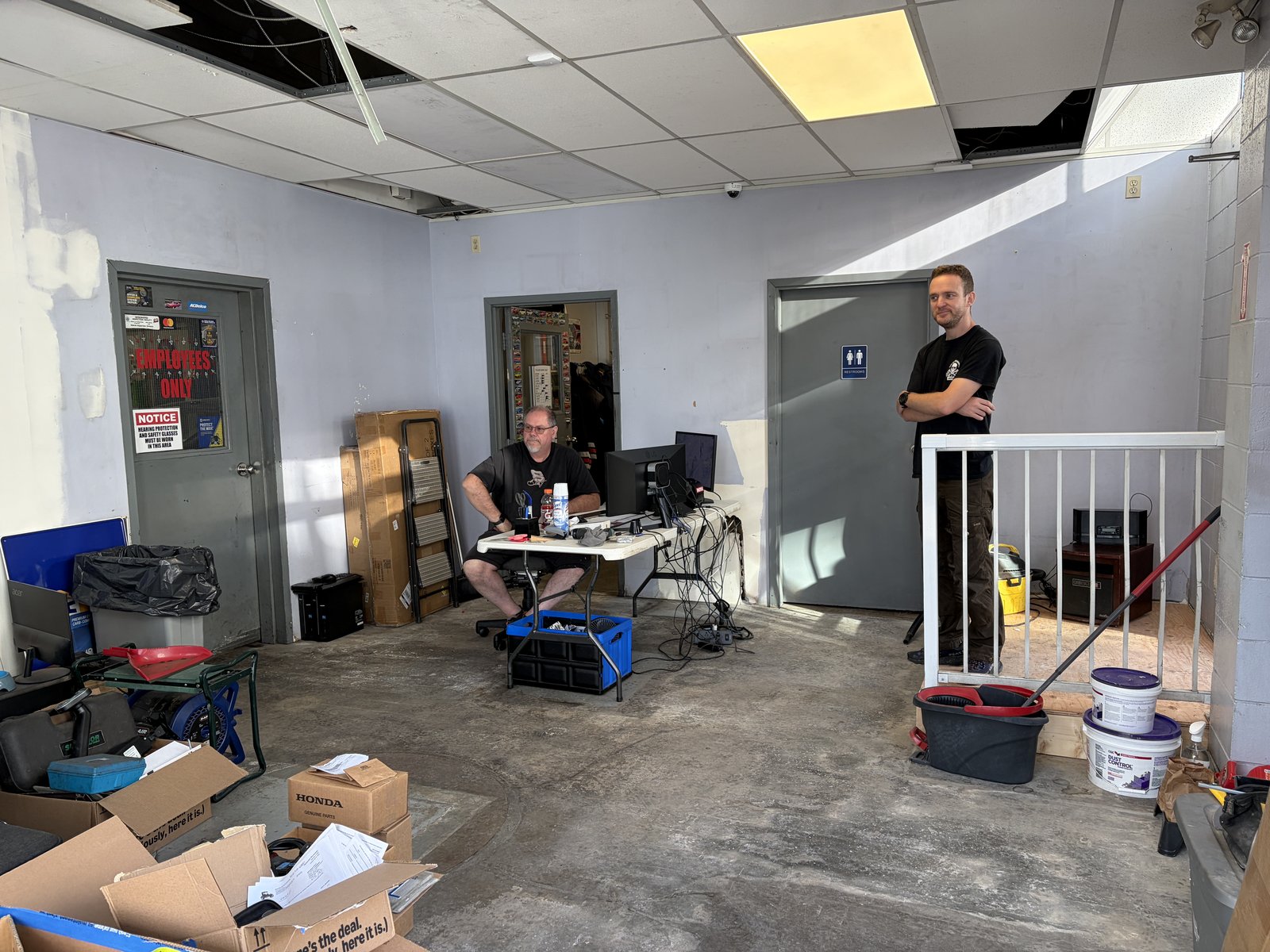 Granville & Avery team in the stripped-down front office mid-renovation