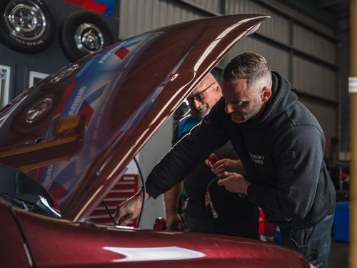 Chris Rinaldi and John Rinaldi inspecting a vehicle during service at Modbury Motors