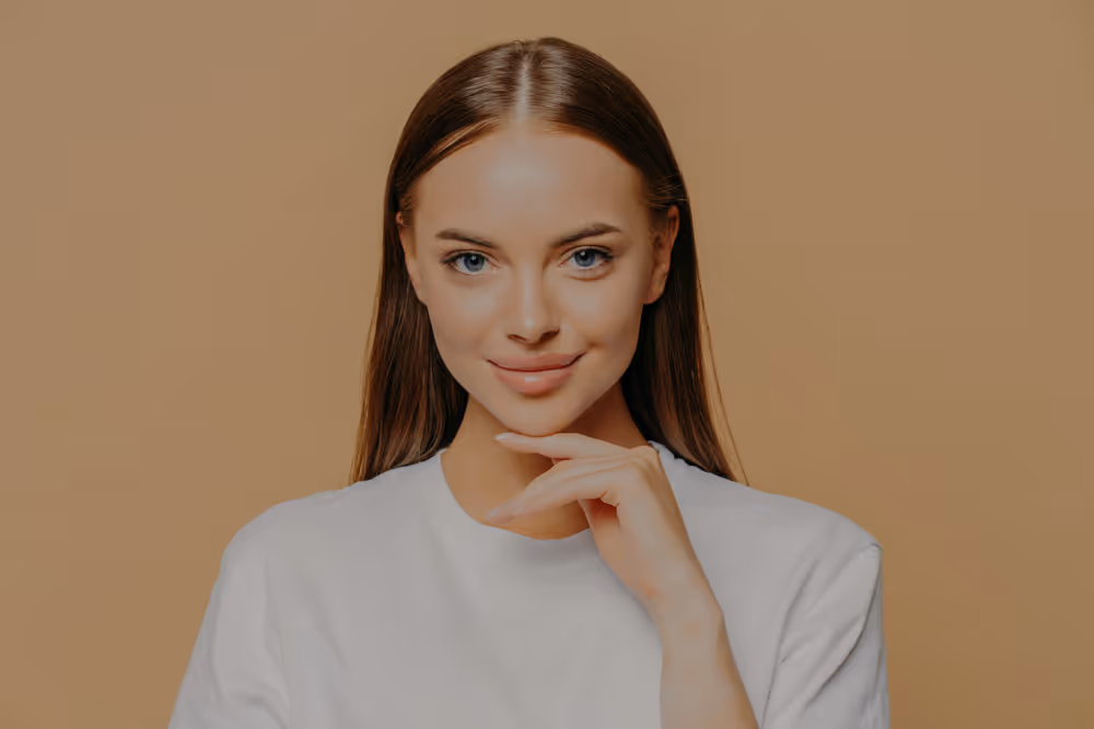 Editorial portrait of a woman resting her chin on her hand