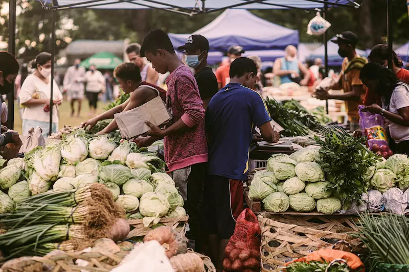 People are buying vegetable in the vegetables market