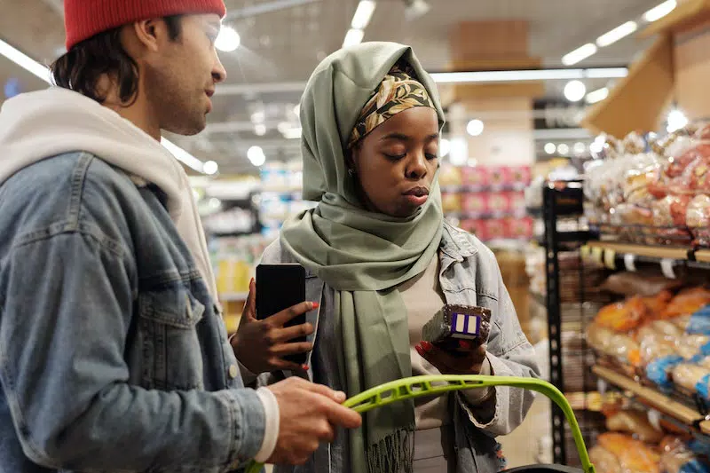 A man and women buying product from a store