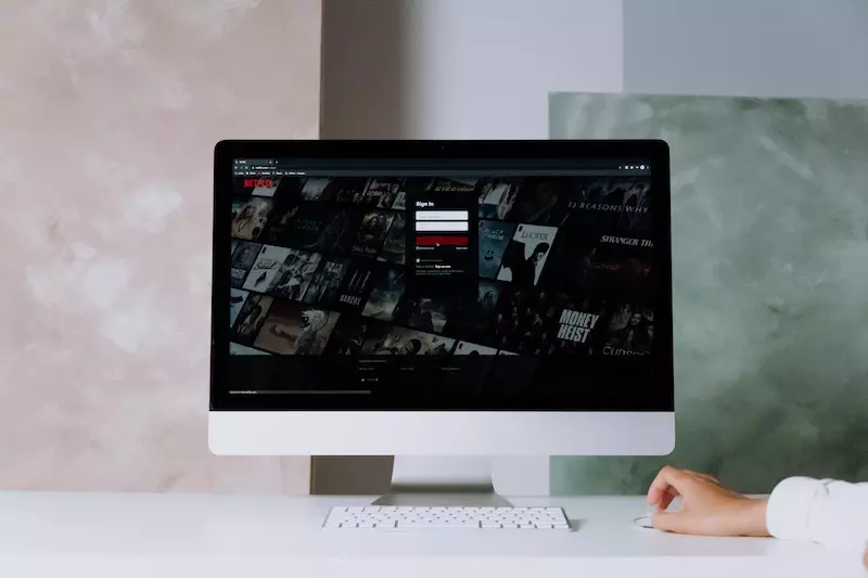 Netflix is shown in the laptop screen
