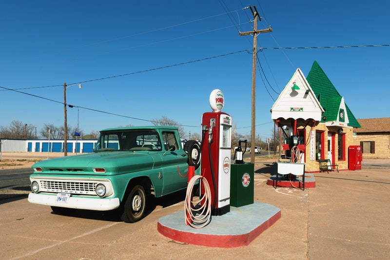 A Car is Standing At Petrol Pump for Filling Fuel
